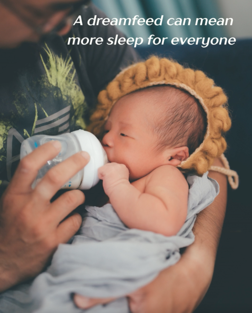 Sleepy newborn having dreamfeed given by dad.